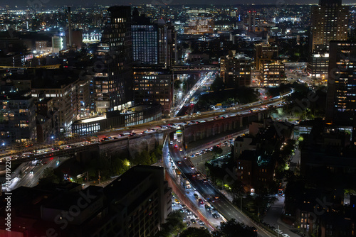 Aerial View of New York City. Helicopter Shot of a Busy Highway in New York City. Panoramic View with Traffic Around a Big City with Skyscrapers in the Background