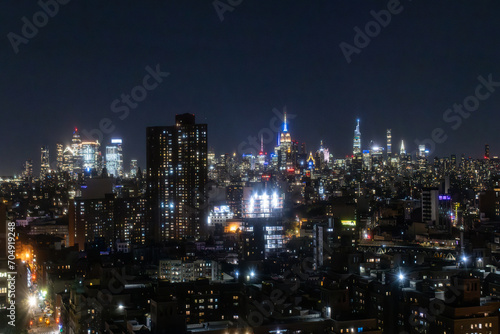 Aerial View of Manhattan Architecture at Night. Night Photo of Financial Business District from a Helicopter. Scenery of Historic Office Towers, Illuminated Skyscrapers