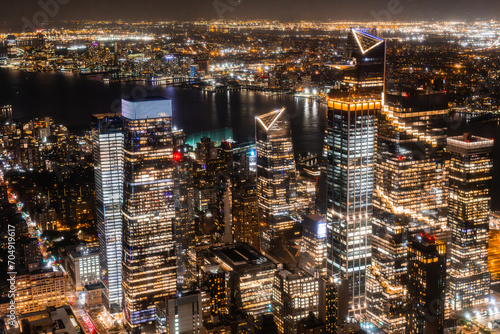 New York City Aerial Night Cityscape with Stunning Manhattan Landmarks  Skyscrapers and Residential Buildings. Wide Angle Panoramic Helicopter View of a Popular Travel Destination