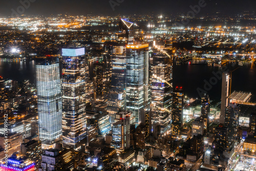 New York City Aerial Night Cityscape with Stunning Manhattan Landmarks  Skyscrapers and Residential Buildings. Wide Angle Panoramic Helicopter View of a Popular Travel Destination