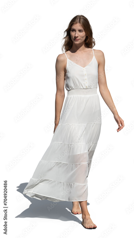 Woman in a white light summer dress walking barefoot isolated on white background