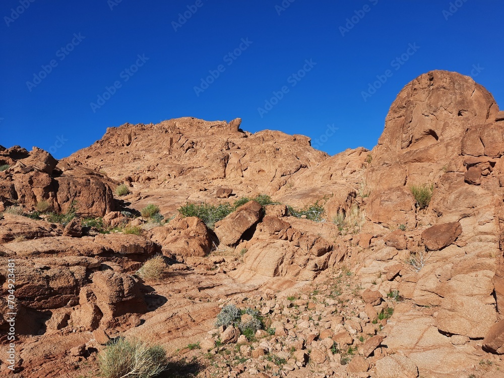 A beautiful  daytime view of the mountain range adjacent to Split Rock in Tabuk, Saudi Arabia.