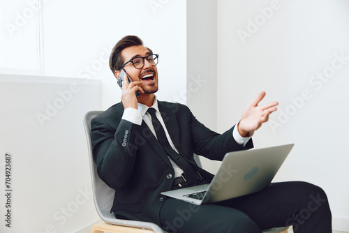 Man talk office laptop computer call technology lifestyle video smile adult conversation chair phone businessman