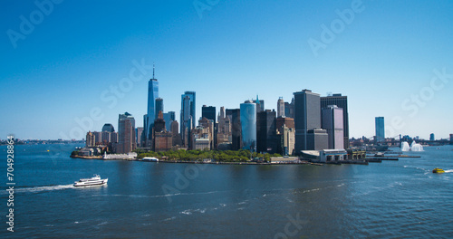 Aerial Photo of Manhattan Island with Office and Apartment Buildings. Hudson River Scenery with Yachts, Boats, One World Trade Center Skyscraper in the Middle of Skyline
