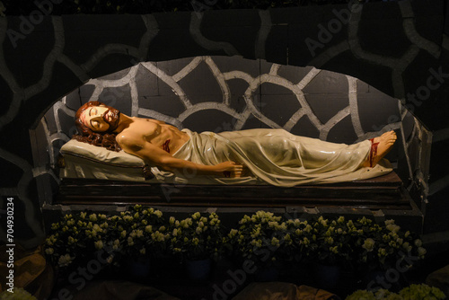 Tablou pe pânză Jesus lying in the grave, scene in the church at Easter.
