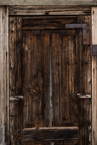 Sunja , Croatia, 05,04,2021: Old wooden rustic door on rural home wall.