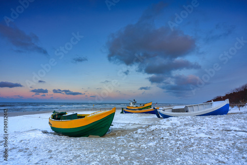 Fototapeta Naklejka Na Ścianę i Meble -  Fishing boats on the Baltic Sea beach in Jantar at winter. Poland