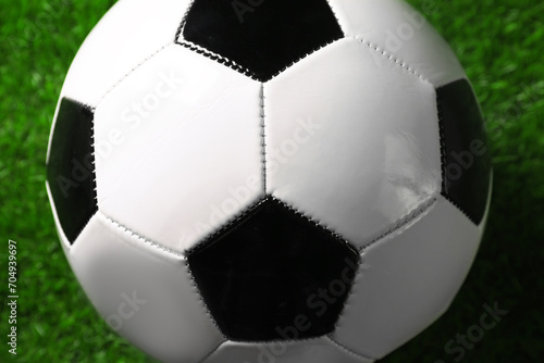 One soccer ball on green grass  closeup. Sports equipment