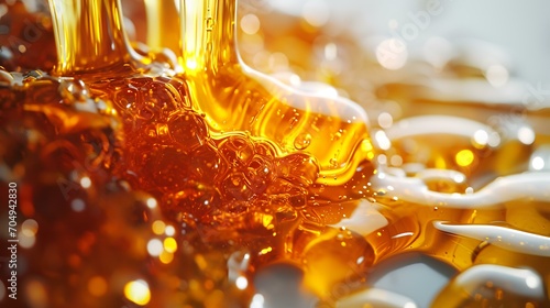Close-up shot of honey flowing into glass. Shallow depth of field.