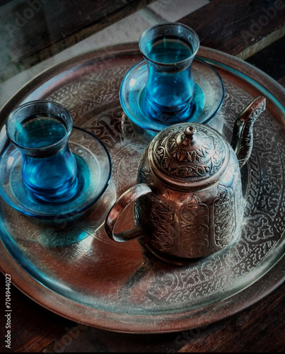 Arabic teapot with two blue glasses. Tea shop. tea time