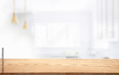 empty wooden table against abstract blur white interior background, montage, product display, inside and window.