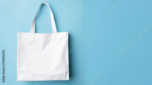 Empty mock-up of a bag made of white fabric, blue background