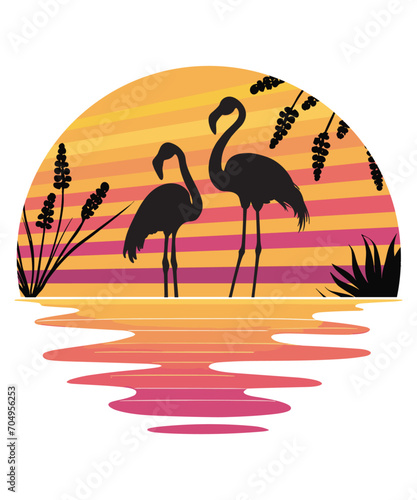 Two flamingos standing against a backdrop of a sunset