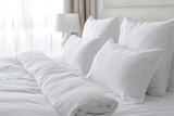 beautiful bed in a hotel room with white pillows