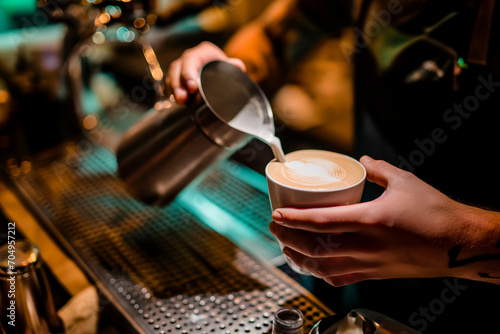 bartender's hands preparing a delicious cappuccino, close up