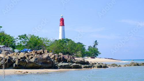 Beautiful Natural Scenery On The Coast Of Tanjung Kalian, With The Lighthouse And Large Rocks