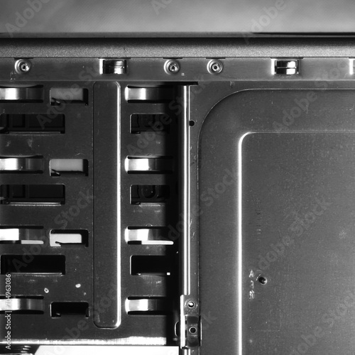 Metal computer case close-up. Computer Accessories Conception. Digital Wallpaper. Monochrome