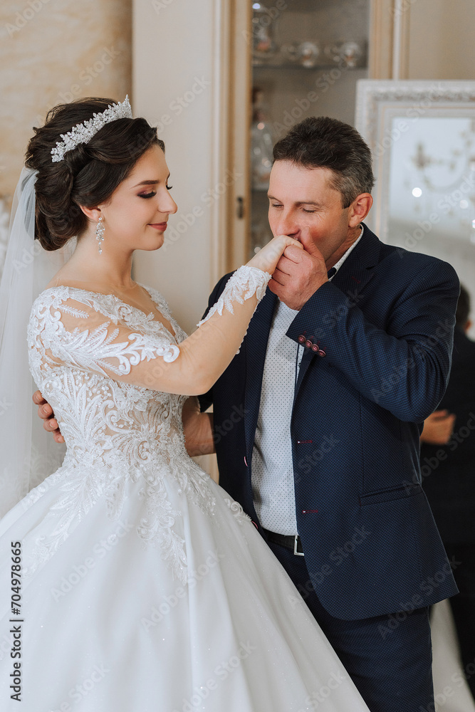 A beautiful bride with her father on her wedding day. The best moments of the wedding day. Daughter and father. A beautiful bride with her father on her wedding day. The best moments of the wedding day. Daughter and father.