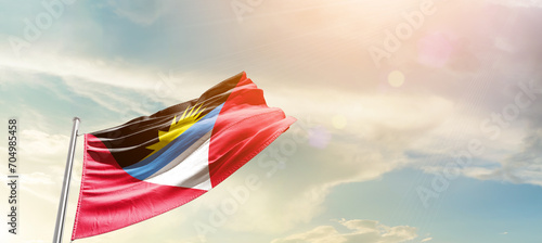 Antigua and Barbuda national flag cloth fabric waving on the sky - Image