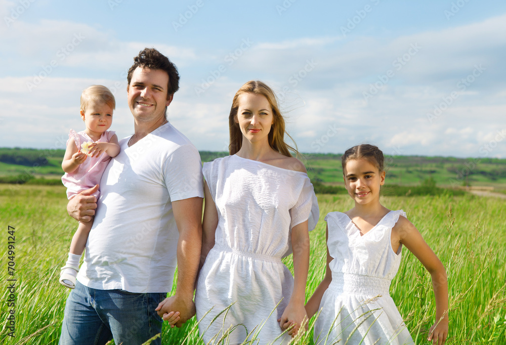Happy young family outdoors
