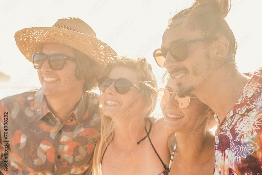 Group of couples friends have fun together at the beach in summer holiday vacation - people and travel activity lifestyle - young men and women enjoy friendship outdoor