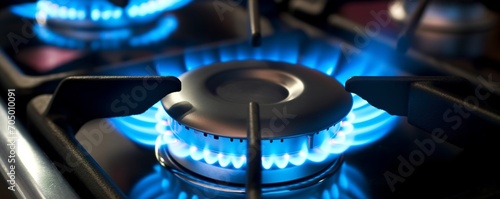 Gas stove with blue flame burning in the kitchen, near black cast iron frame. Generative AI