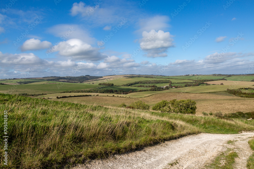 Looking out over the South Downs from near Kingston Ridge, with a blue sky overhead Looking out over the South Downs from near Kingston Ridge, with a blue sky overhead
