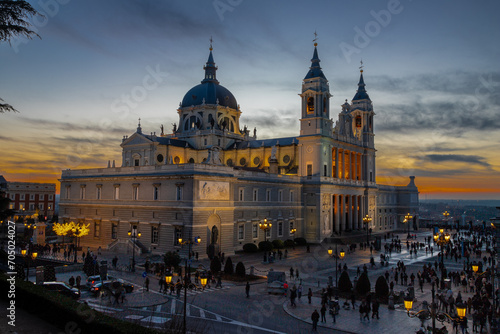 Madrid, Spain 28-12-2022 The Almudena Cathedral during a colorful sunset, it is the most important  and Catholic religious building in Madrid and a visit is free of charge except for the crypt   photo