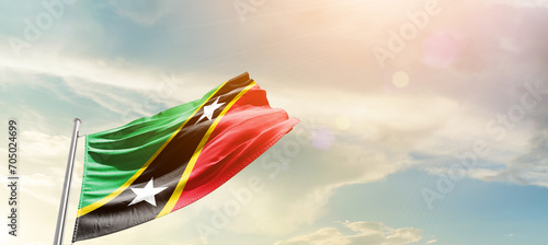 Saint Kitts and Nevis national flag cloth fabric waving on the sky - Image photo