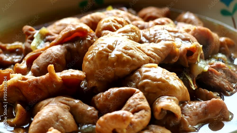 Stewed pork intestines in bowl, in door Chiangmai Thailand. Stewed pork intestines in bowl, in door Chiangmai Thailand.