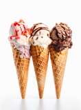 Three ice cream wafer cones with different flavors on white background.