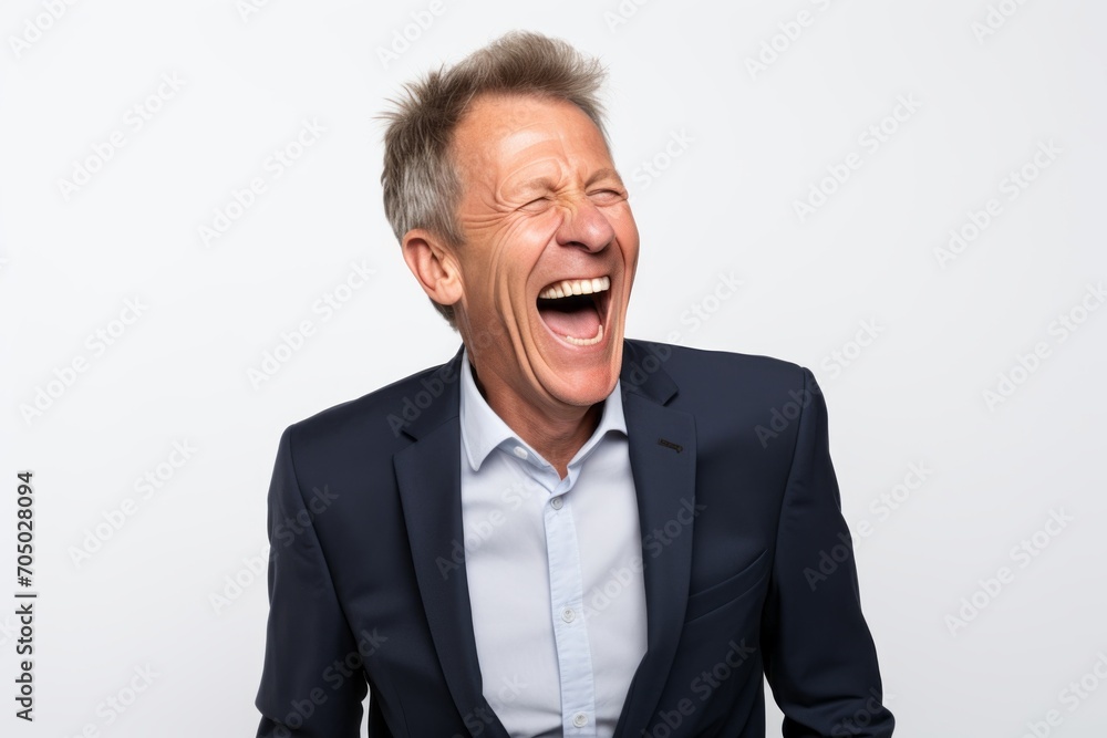 Portrait of a happy senior man laughing on a white background. Portrait of a happy senior man laughing on a white background.