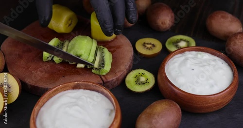 Ripe kiwi fruit close-up on a board, making creamy yogurt with kiwi fruit photo