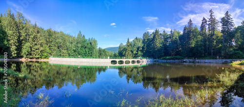 panoramic view to Dam on the Lomnica River, semicircular dam with five overflows in Karpacz, Poland