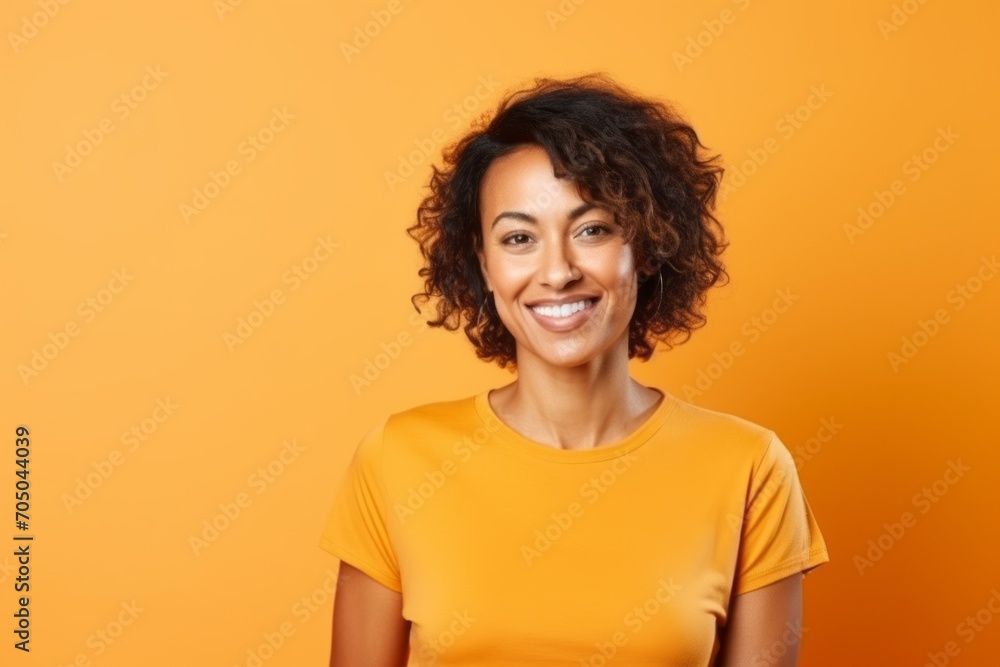 Portrait of a smiling african american woman on orange background Portrait of a smiling african american woman on orange background