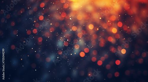 Dark abstract background with bokeh and sparkles.