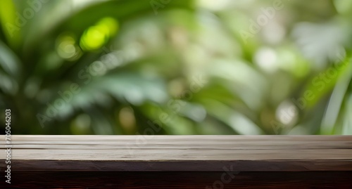 Empty wooden table against a blurry rainforest tropics background. Advertising background for product display