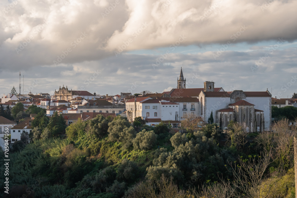 Viewpoint to the apse of the gothic Graça church and Santarém Cathedral in the background at sunset, PORTUGAL