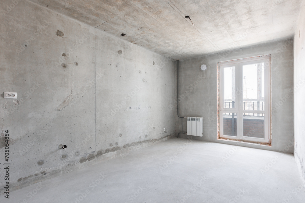 interior of the apartment without decoration in gray colors. rough finish