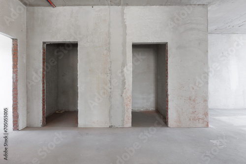 interior of the apartment without decoration in gray colors. rough finish