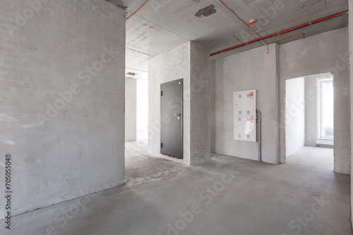 interior of the apartment without decoration in gray colors. rough finish