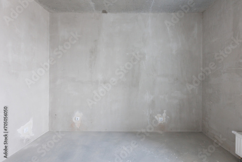 interior of the apartment without decoration in gray colors. rough finish