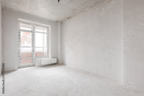 interior of the apartment without decoration in gray colors. rough finish