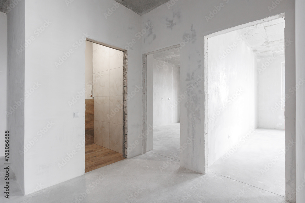 Fototapeta premium interior of the apartment without decoration in gray colors. rough finish
