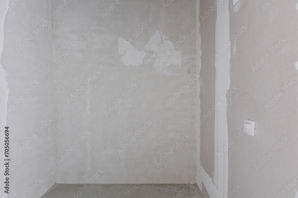 interior of the apartment without decoration in gray colors. rough finish interior of the apartment without decoration in gray colors. rough finish