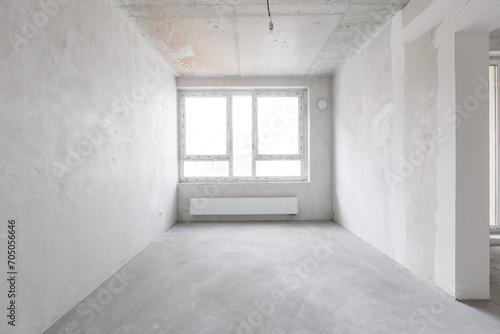 interior of the apartment without decoration in gray colors. rough finish