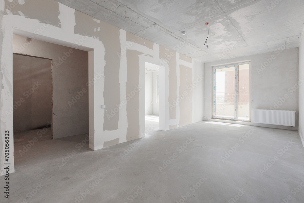 interior of the apartment without decoration in gray colors. rough finish interior of the apartment without decoration in gray colors. rough finish