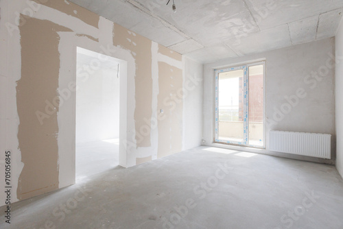 interior of the apartment without decoration in gray colors. rough finish