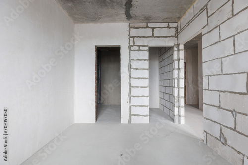 interior of the apartment without decoration in gray colors. rough finish