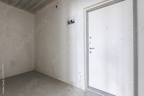 interior of the apartment without decoration in gray colors. rough finish